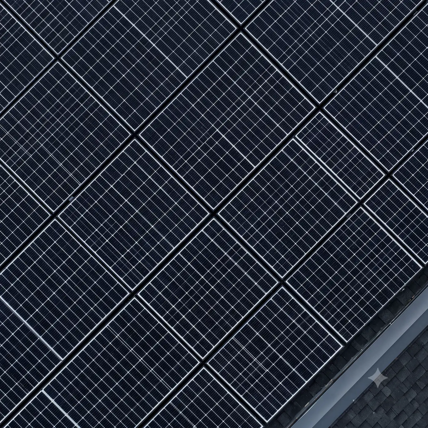 Overhead view of a monocrystalline solar array forming a repeating grid